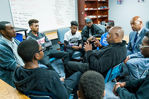Professional men mentoring young men