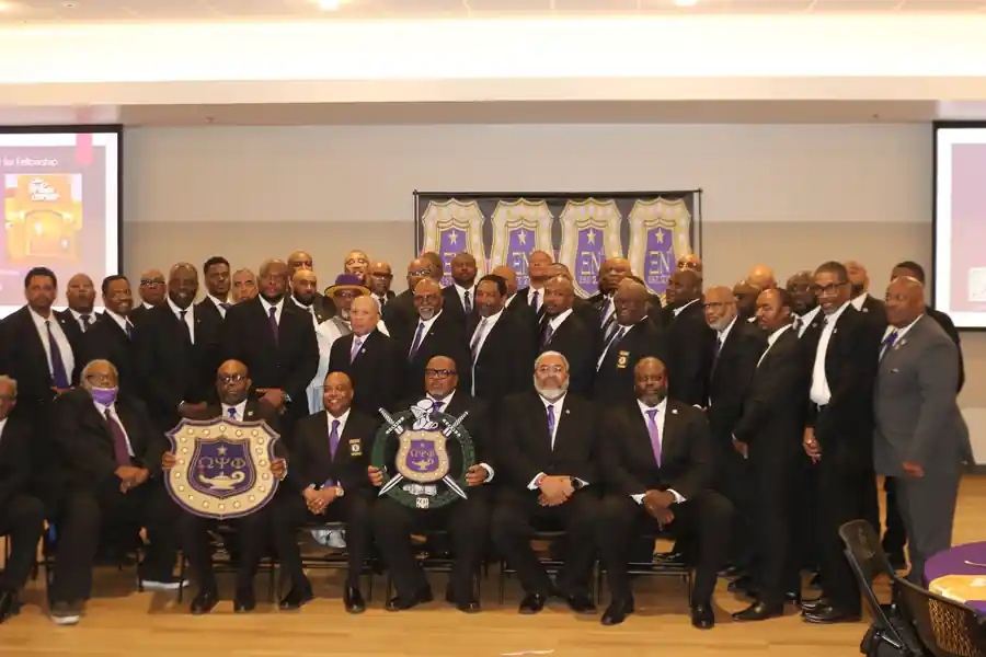 Xi Nu Nu and Omega Psi Phi brothers gathered at a formal fraternity event